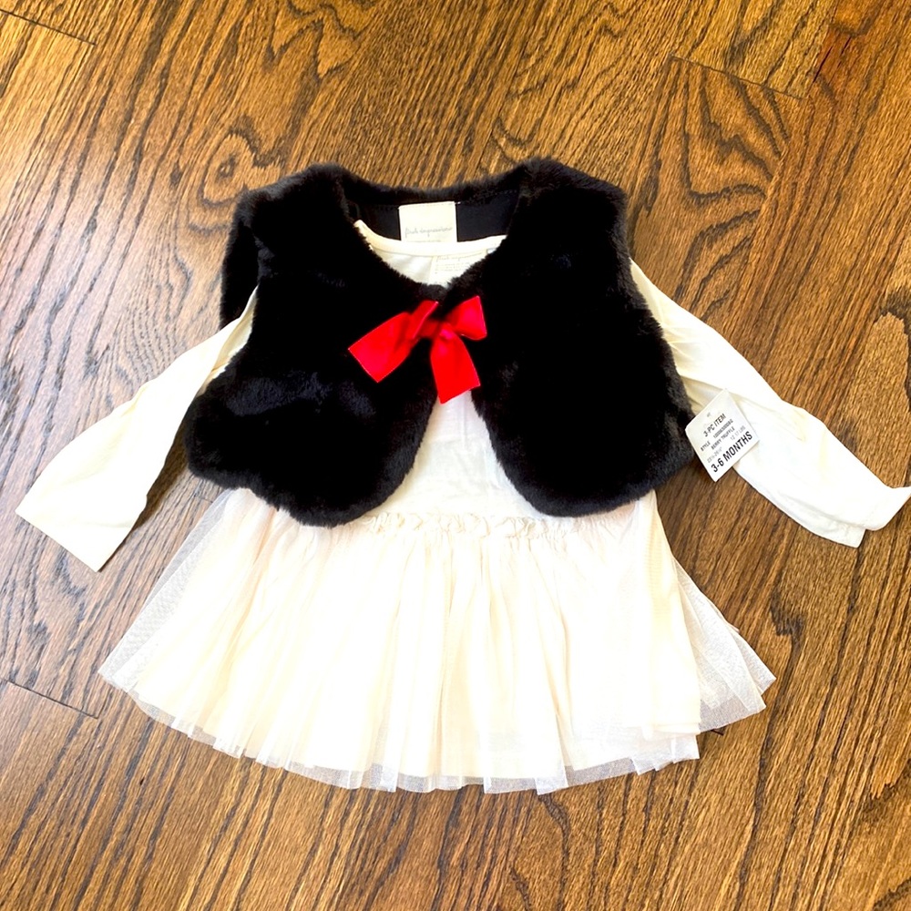 Cream dress with pleated skirt and Black faux fur vest. NWT